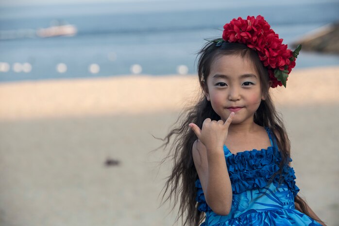 An Oshima Island child and participant in the hula dancing during the U.S. – Japan Luau Party poses for a picture on Oshima Island, Japan, July 23, 2016. Residents of Marine Corps Air Station Iwakuni visited the island of Oshima to join in celebration of the island’s history and the bond between the U.S. and Japan. (U.S. Marine Corps photo by Cpl. Nathan Wicks)