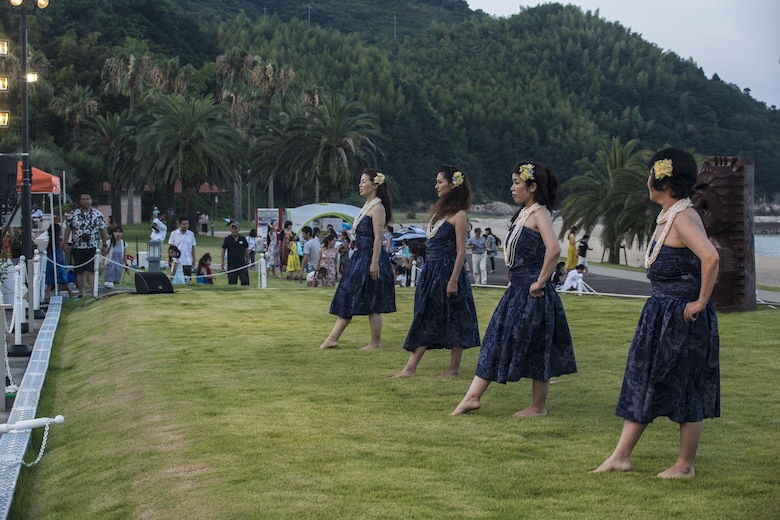 Hula dancers prepare to kick-off their performance during the U.S. – Japan Luau Party on Oshima Island, Japan, July 23, 2016. Residents of Marine Corps Air Station Iwakuni visited the island of Oshima to join in celebration of the island’s history and the bond between the U.S. and Japan. (U.S. Marine Corps photo by Cpl. Nathan Wicks)