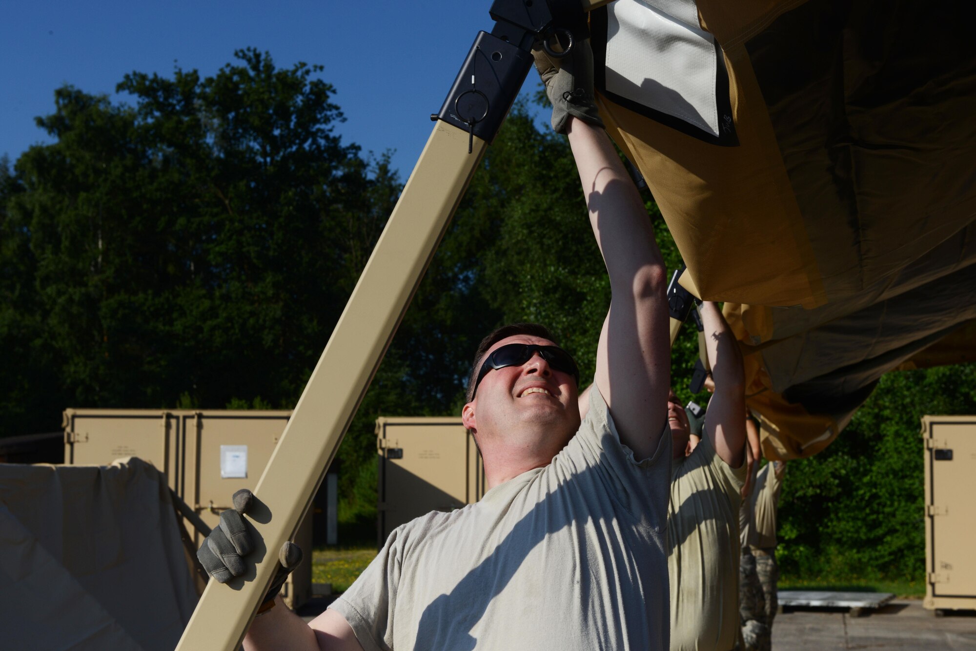 435th Contingency Response Group Airmen put together a Tent Model 60 tent at Ramstein Air Base, Germany, July 18, 2016. The 435th CRG recently acquired tents to replace the Deployable Rapid Assembly Shelter. (U.S. Air Force photo/ Airman 1st Class Joshua Magbanua)