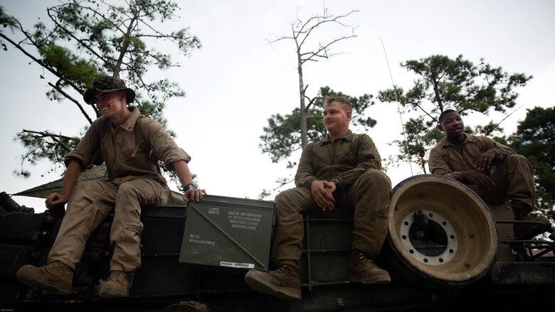 Marines with Fox Company, 4th Tank Battalion, sit atop their M1A1 Abrams battle tank and laugh at the idea of getting their photo taken during a training exercise on Marine Corps Base Camp Lejeune, July 19, 2016. The exercise brought the reserve Marines together with elements of 2nd Tank Bn. to train in the event they deploy as one battalion in the future. 