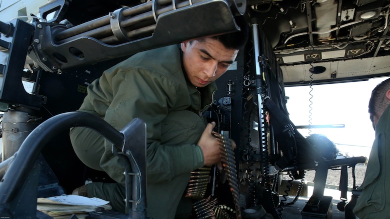 Lance Cpl. Anthony Loberg stages ammunition before a close air support exercise at Pohakuloa Training Area, Hawaii, July 19, 2016. Loberg is participating in Rim of the Pacific 2016, a multinational military exercise, from June 29 to Aug. 8 in and around the Hawaiian Islands. RIMPAC offers the U.S. military the opportunity to train with partners and allies in the Pacific region. Loberg, a native of Santa Maria, California, is a UH-1Y Huey crew chief with Marine Light Attack Helicopter Squadron 367, which supports III Marine Expeditionary Force. 