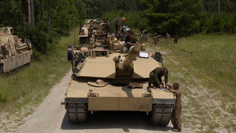 Marines with Fox Company, 4th Tank Battalion, plan a notional attack during a simulated offensive exercise at Marine Corps Base Camp Lejeune, N.C., July 19, 2016. The tank platoon coordinated prior to executing the mission in order to establish communication, logistics and course of action. 