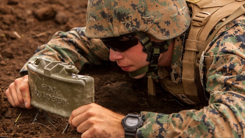 U.S. Marine Corps Lance Cpl. Kendal Kleinhenz, a combat engineer with Marine Wing Support Squadron 171 stationed at Marine Corps Air Station Iwakuni, Japan, deploys an M18A1 Claymore Mine during exercise Eagle Wrath 2016 at Combined Arms Training Center Camp Fuji, July 20, 2016. The squadron plans to complete their unit annual training requirements throughout three stages, which focus on air base ground defense and Marine Corps common skills that Marines are unable to train for locally. 