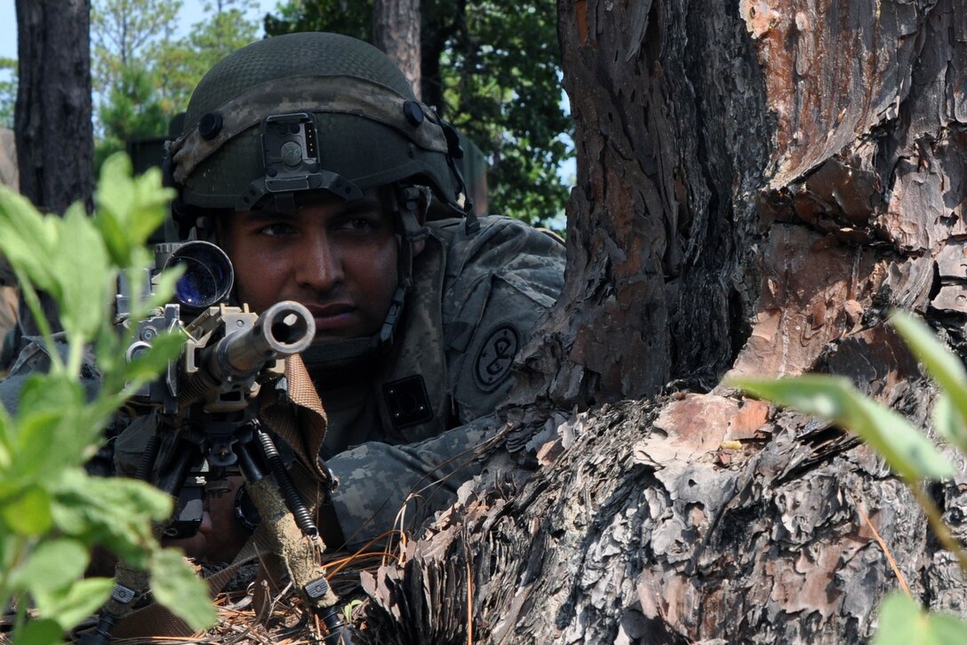 Army Sgt. Alexis Bruno provides security during training at the Joint Readiness Training Center in Fort Polk, La., July 25, 2016. Bruno is a sniper assigned to New York National Guard's Headquarters Company, 1st Battalion, 69th Infantry Regiment. About 5,000 soldiers, including those from the Guard, honed their skills and practiced integrating combat operations as part of the 27th Infantry Brigade Combat Team task force. Army National Guard photo by Sgt. Maj. Corine Lombardo