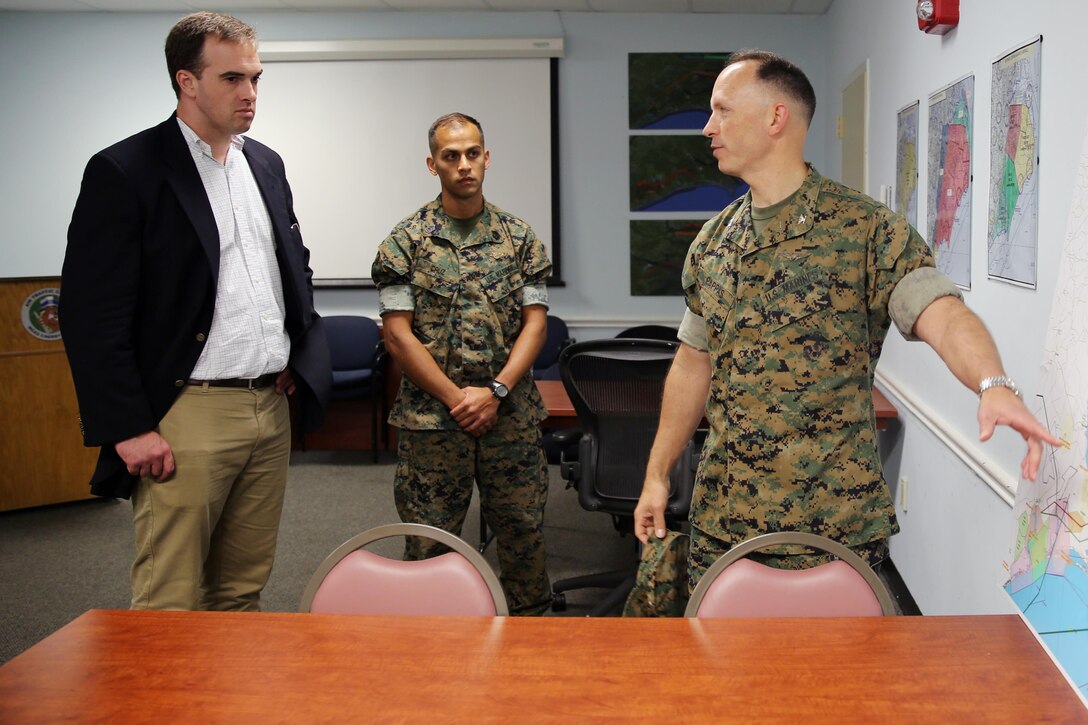 Col. Chris Pappas III (right) explains how the area around the air station is used for training purposes to Chad Sydnor (left) and Gunnery Sgt. Louie Cruz at Marine Corps Air Station Cherry Point, N.C., July 19, 2016. Sydnor, the military legislative assistant for U.S. Sen. Richard Burr, visited Cherry Point to become more familiar with the air station’s mission and issues within Burr’s purview. Sydnor visited various places on the air station, including Fleet Readiness Center East, the Air Traffic Control tower, and the Devil Dog Gym. Pappas is the commanding officer for MCAS Cherry Point and Cruz is the radar chief with Headquarters and Headquarters Squadron. (U.S. Marine Corps photo by Lance Cpl. Mackenzie Gibson/Released)