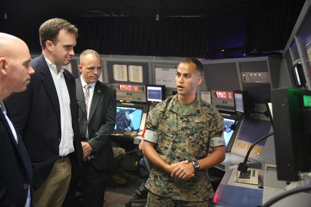 Gunnery Sgt. Louie Cruz (right) explains how radar operations works to Chad Sydnor (left) in the radar room at Marine Corps Air Station Cherry Point, N.C., July 19, 2016. Sydnor, the military legislative assistant for U.S. Sen. Richard Burr, visited Cherry Point to become more familiar with the air station’s mission and issues within Burr’s purview. Sydnor visited various places on the air station, including Fleet Readiness Center East, the Air Traffic Control tower, and the Devil Dog Gym. Cruz is the radar chief for Headquarters and Headquarters Squadron. (U.S. Marine Corps photo by Lance Cpl. Mackenzie Gibson/Released)
