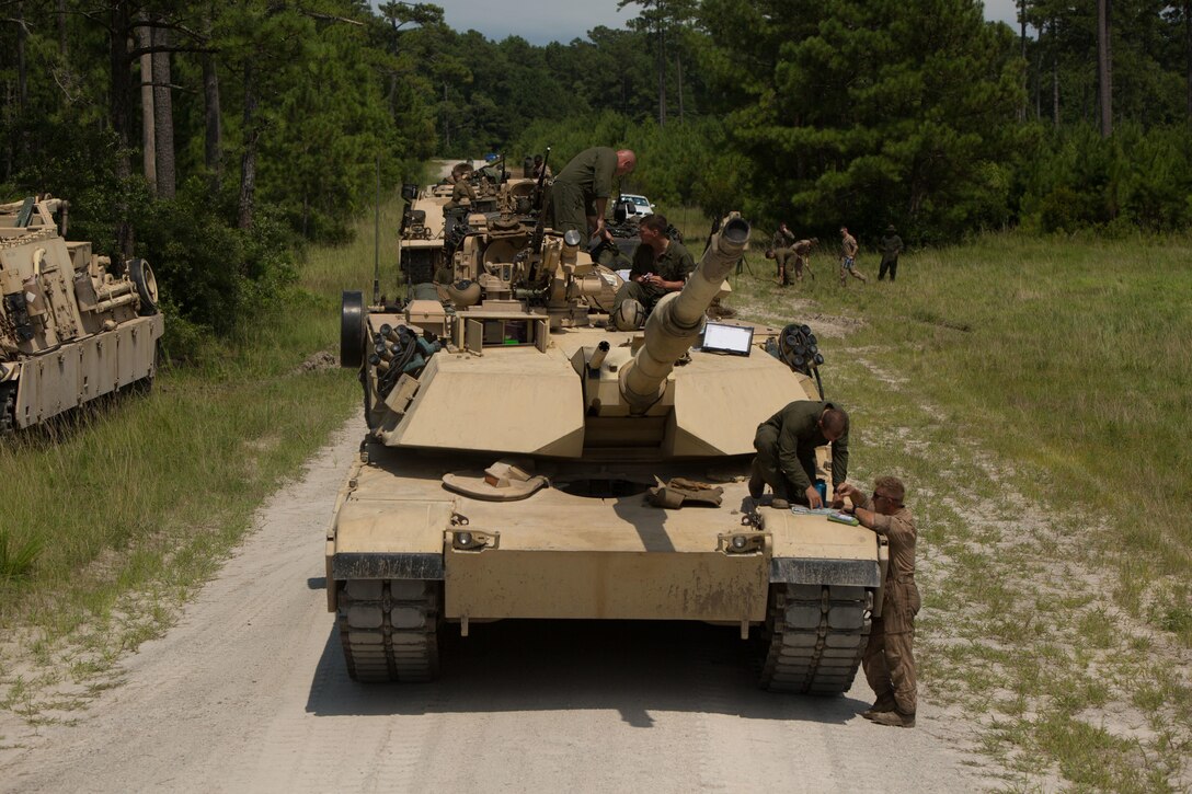 Marines with Fox Company, 4th Tank Battalion, plan a notional attack during a simulated offensive exercise at Camp Lejeune, N.C., July 19, 2016. The tank platoon coordinated prior to executing the mission in order to establish communication, logistics and course of action. (U.S. Marine Corps photo by Pfc. Juan Soto-Delgado)