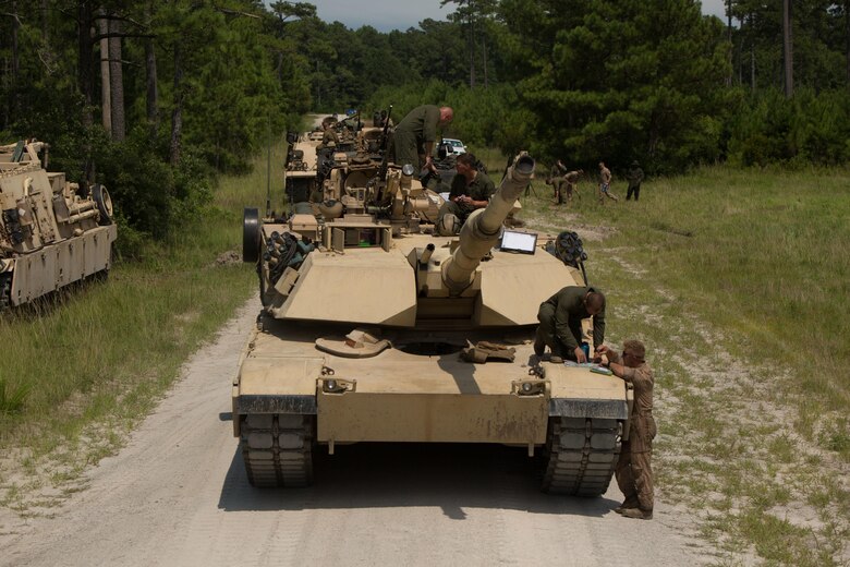 Marines with Fox Company, 4th Tank Battalion, plan a notional attack during a simulated offensive exercise at Camp Lejeune, N.C., July 19, 2016. The tank platoon coordinated prior to executing the mission in order to establish communication, logistics and course of action. (U.S. Marine Corps photo by Pfc. Juan Soto-Delgado)