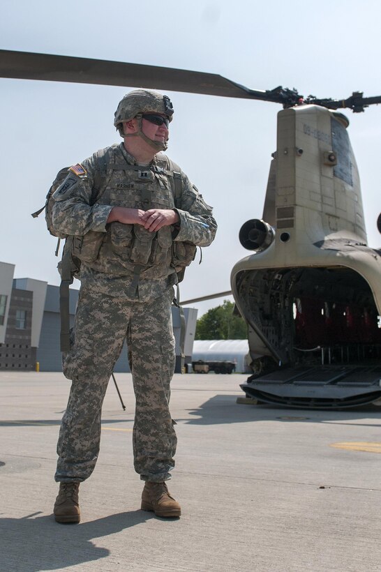 Army Capt. James Harhen observes soldiers boarding a CH-47 Chinook helicopter at the Army Aviation Support Facility in South Burlington, Vt., July 20, 2016. Harhen is commander of the Vermont National Guard’s Company A, 86th Special Troops Battalion. Army National Guard photo by Spc. Avery Cunningham