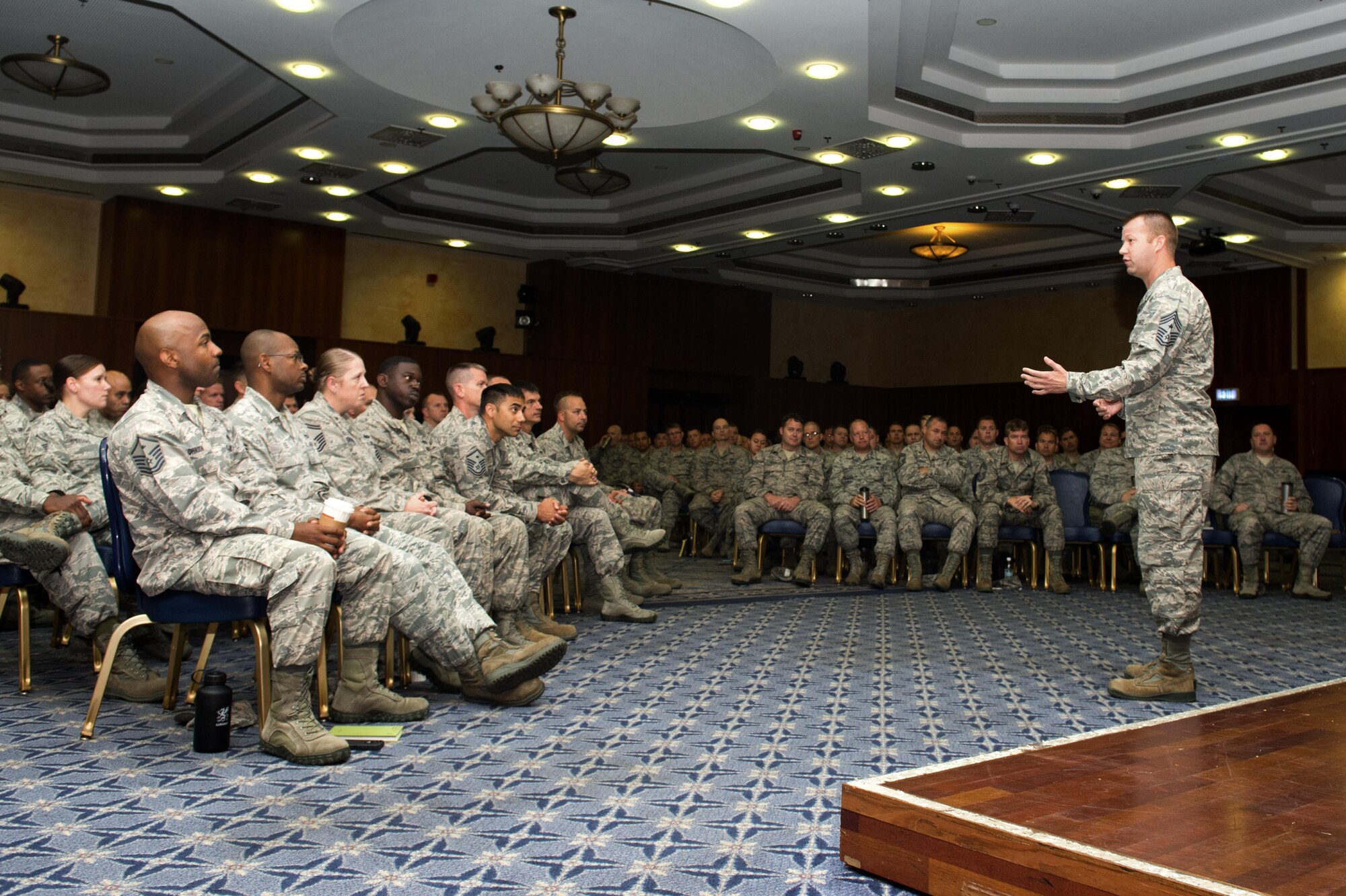U.S. Air Force Chief Master Sgt. Edwin Ludwigsen, 52nd Fighter Wing command chief, answers a question at his first senior NCO all call as command chief at Club Eifel on Spangdahlem Air Base, Germany, July 26, 2016. The command chief spoke about performance reviews and answered questions from senior NCOs in attendance. (U.S. Air Force photo by Airman 1st Class Preston L. Cherry/Released)