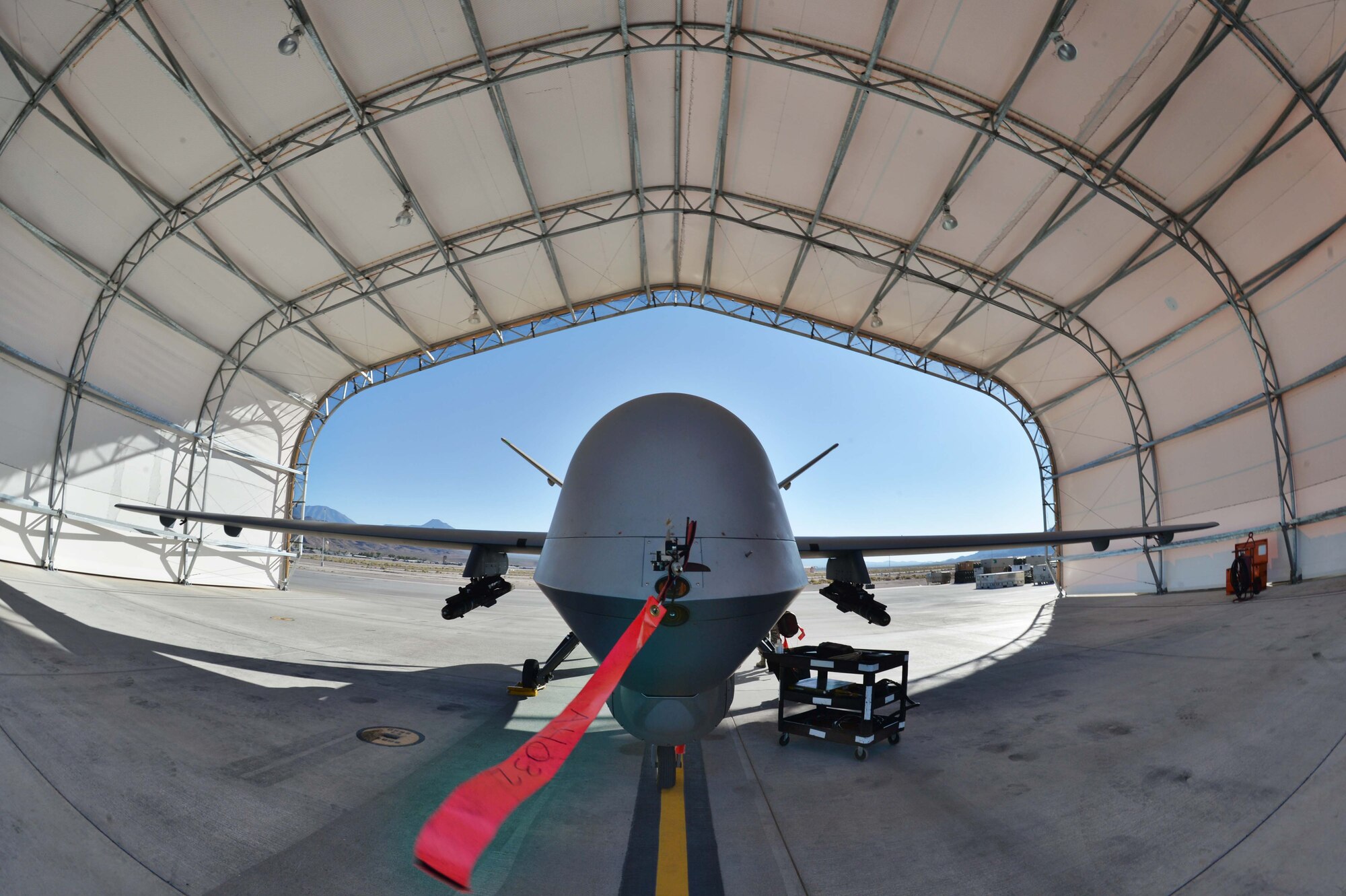 An MQ-9 Reaper sits prior to a launch in support of Red Flag 16-3 July 20, 2016, at Creech Air Force Base, Nevada. The exercise incorporates scenarios in air, space and cyber systems to provide aircrews realistic training for combat operations. (U.S. Air Force photo by Airman 1st Class Kristan Campbell/Released)