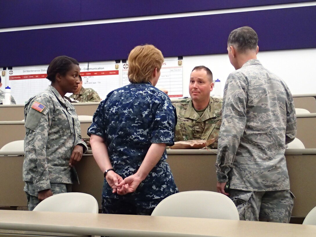Col. Erik Kirchen, commander of the 48th Combat Support Hospital, Fort Meade, Md., has a command meeting with the senior leaders of the Army, Navy and Air Force during Greater Chenango Cares IRT event July 17, 2016.  Greater Chenango Cares is one of the Innovative Readiness Training missions which provides real-world training in a joint civil-military environment while delivering world class medical care to the people of Chenango County, N.Y., from July 15-24.