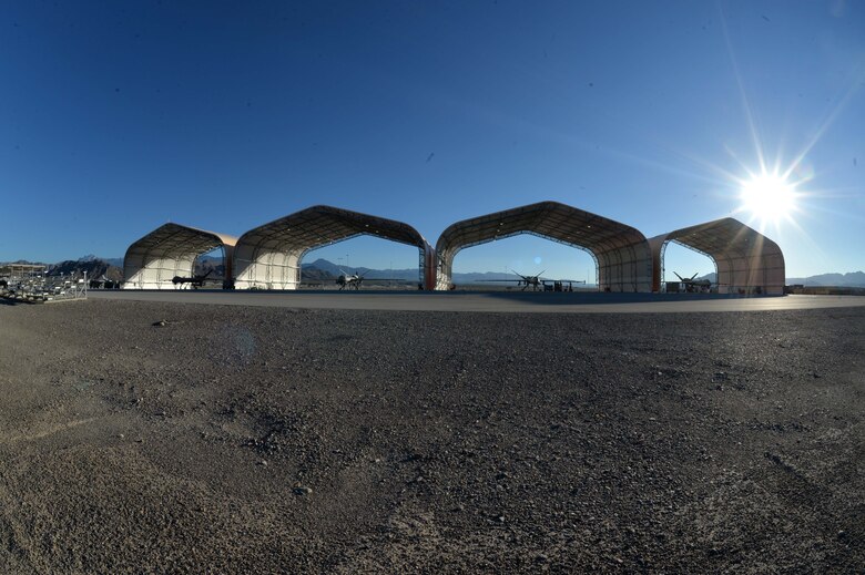 Airmen assigned to 432nd Aircraft Maintenance Squadron perform pre and post-flight operations on MQ-9 Reapers in support of Red Flag 16-3 July 20, 2016, at Creech Air Force Base, Nevada. Red Flag is an exercise held four times a year and tests participants in various combat training scenarios. (U.S. Air Force photo by Airman 1st Class Kristan Campbell/Released)