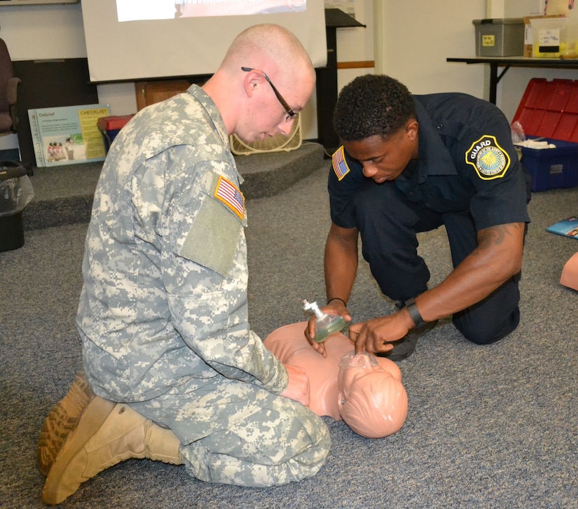 Pfc. David Miles, 650th Regional Support Group military policeman, learns how to preform cardiopulmonary resuscitation on a Madigan during a Combat Lifesaver Course at the Fort Irwin National Training Center, where he was undergoing mandatory law enforcement training July 20. The Military Police remain the force of choice because of the combat force multiplier that they bring to the battlefield and their transition capability to Law and Order Operations.