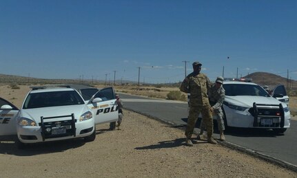 Capt. Monty McCoy, 650th Regional Support Group force protection officer, volunteers to be arrested during a traffic stop training session at the Fort Irwin National Training Center where he was undergoing mandatory law enforcement training July 20. The Military Police remain the force of choice because of the combat force multiplier that they bring to the battlefield and their transition capability to Law and Order Operations.