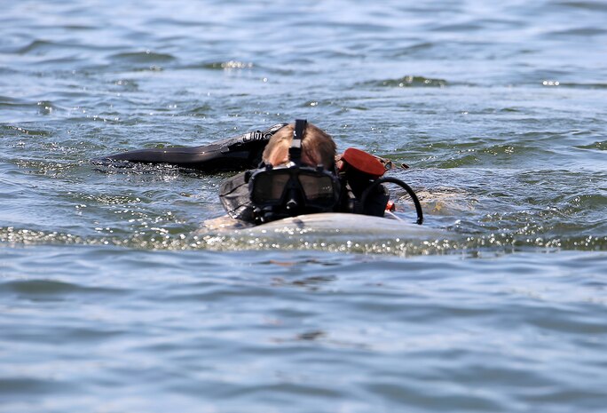 Master Sgt. Brad Colbert, project officer for small craft and special projects with Reconnaissance and Amphibious Raids at Marine Corps Systems Command, drives a Diver Propulsion Device July 18 at Lake Anna in Spotsylvania, Va. Colbert and other members of the RAR team conducted tests of potential upgrades to the DPD to improve its speed and controllability for reconnaissance Marines. (U.S. Marine Corps photo by Monique Randolph)