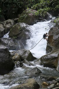 Kim Liszka, an emergency room nurse from Macungie, Pennsylvania, descends a rope to cross a river while competing on the Discovery Channel's survival competition series American Tarzan, which was filmed on the Caribbean island of Dominica. The former Army Reserve captain is one of four competitors left standing on the show. The finale airs Wednesday, July 27 at 10/9 C on the Discovery Channel.