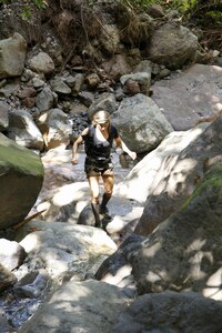 Kim Liszka, an emergency room nurse from Macungie, Pennsylvania, navigates her way across large rocks along a creek bed while filming the survival competition series American Tarzan. Liszka, a former Army Reserve captain, says her previous military training helped her survive  and navigate grueling obstacles while on the Caribbean island of Dominica. The American Tarzan finale airs Wednesday night, July 27 at 10/9 C on the Discovery Channel.