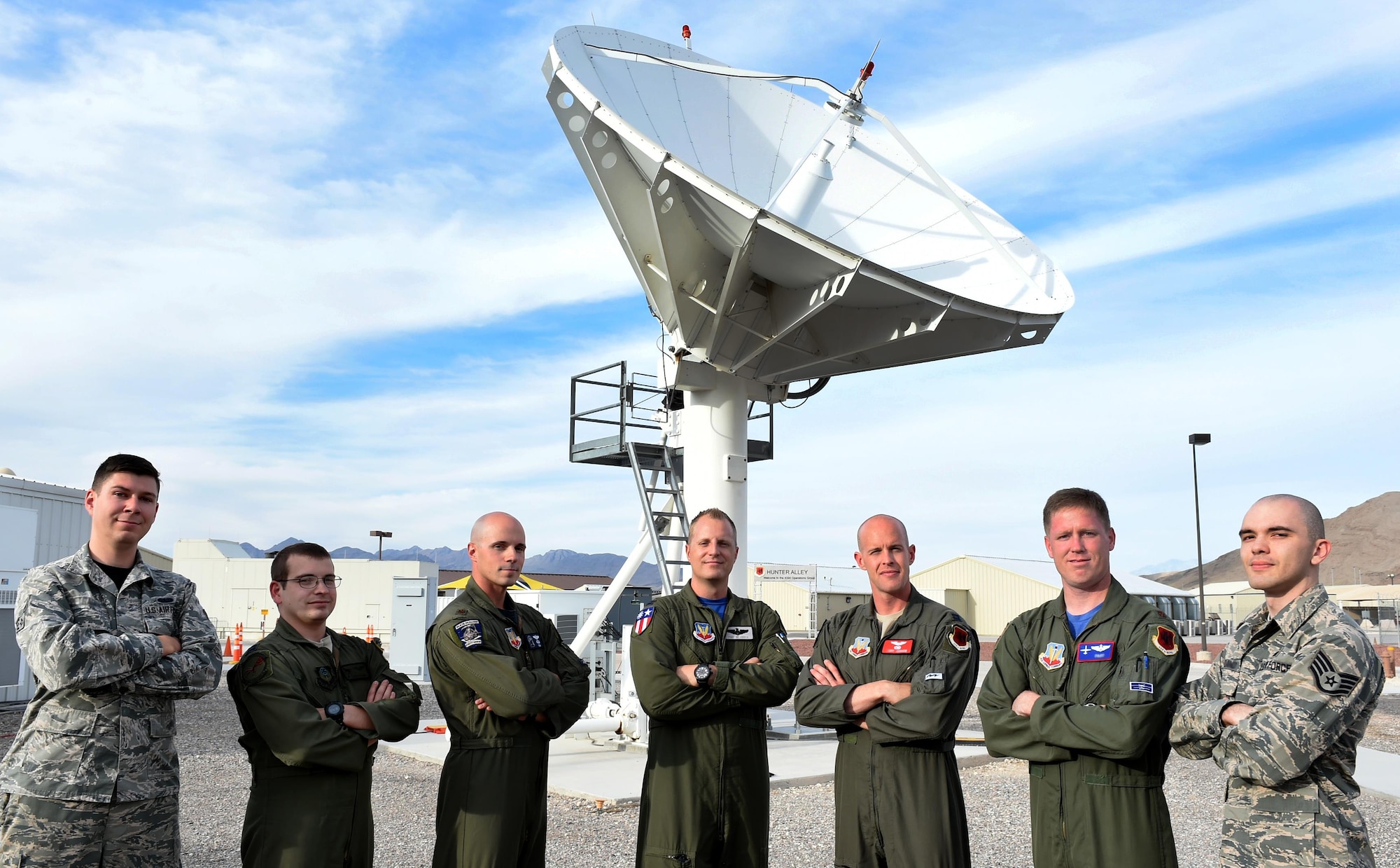 Airmen from the 432nd Wing/432nd Air Expeditionary Wing pose with their instructor, Capt. Craig, 26th Weapon Squadron MQ-9 Pilot (center), after graduating from the U.S. Air Force’s first-ever Electronic Combat Officers course. The course focuses on training aircrews of MQ-1 Predator and MQ-9 Reaper aircraft to mitigate potential signal interruptions thus reducing the potential risks to RPAs. (U.S. Air Force photo by Tech. Sgt. Nadine Barclay)