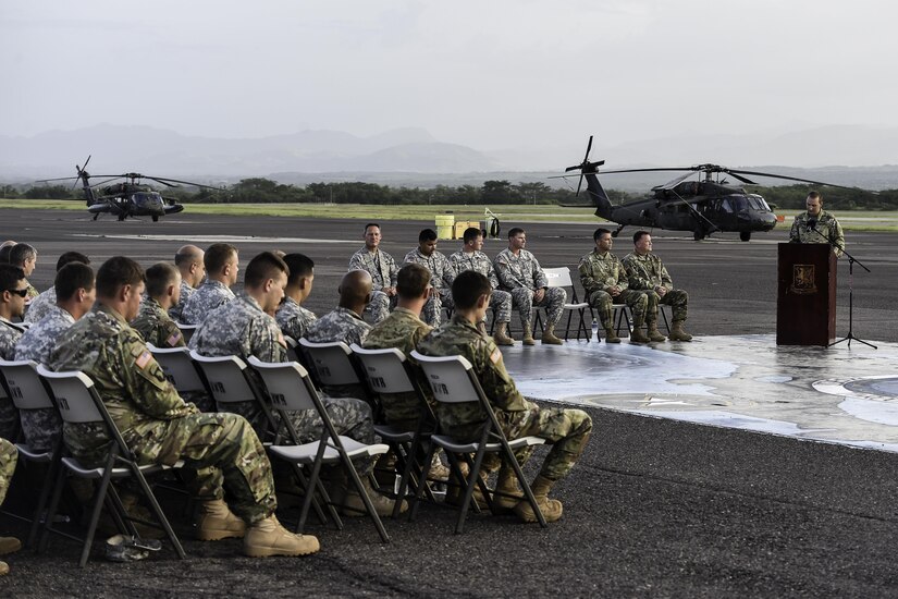 U.S. Army Capt. Cody Thompson, 1st Battalion, 228th Aviation Regiment Alpha Company commander, speaks during a memorial service for U.S. Army Spc. Kyle Gantt at Soto Cano Air Base, Honduras, July 24, 2016. The common theme that was repeated by all who spoke about Gantt was that of his sense of humor and ability to make everyone smile. (U.S. Air Force photo by Staff Sgt. Siuta B. Ika)