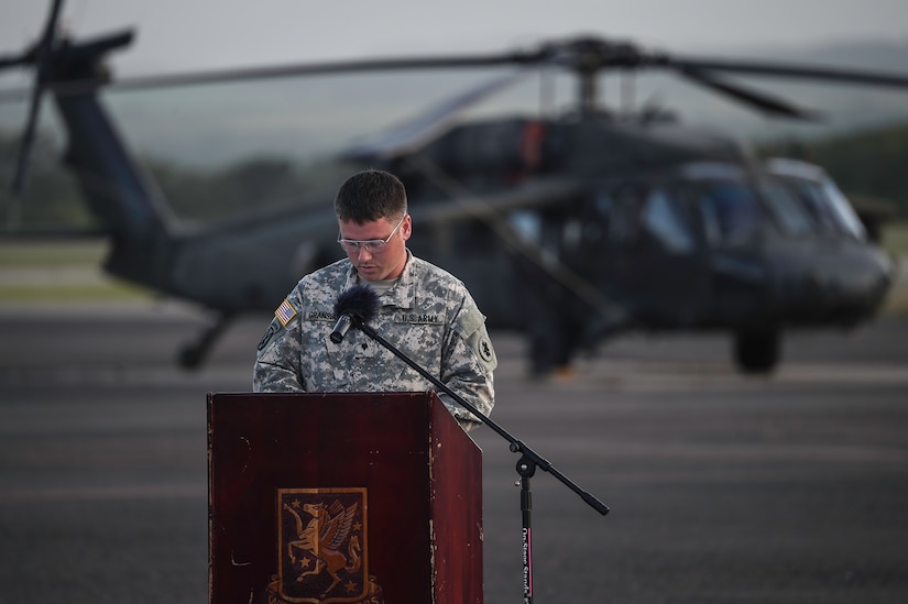 U.S. Army Spc. Seth Gransbury, 1st Battalion, 228th Aviation Regiment, speaks during a memorial service for U.S. Army Spc. Kyle Gantt at Soto Cano Air Base, Honduras, July 24, 2016. Gantt befriended Gransbury when the two attended Advanced Individual Training together in 2012. (U.S. Air Force photo by Staff Sgt. Siuta B. Ika)