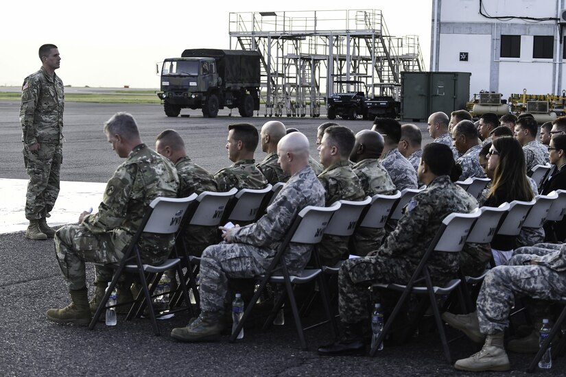 U.S. Army 1st Sgt. Steven Howe, 1st Battalion, 228th Aviation Regiment senior Noncommissioned Officer, sounds a ceremonial roll call during a memorial service for U.S. Army Spc. Kyle Gantt at Soto Cano Air Base, Honduras, July 24, 2016. When no reply was heard after Howe called Gantt’s name three times, Howe requested all present stand for military honors, consisting of a 21-gun salute and the playing of Taps.  (U.S. Air Force photo by Staff Sgt. Siuta B. Ika)