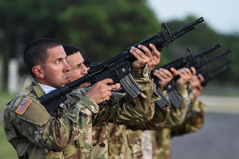 Members of the Joint Task Force-Bravo Honor Guard perform a 21-gun salute during a memorial service for U.S. Army Spc. Kyle Gantt at Soto Cano Air Base, Honduras, July 24, 2016. Gantt, who was raised in Piqua, Ohio, enlisted in the Army in February 2012. (U.S. Air Force photo by Staff Sgt. Siuta B. Ika)