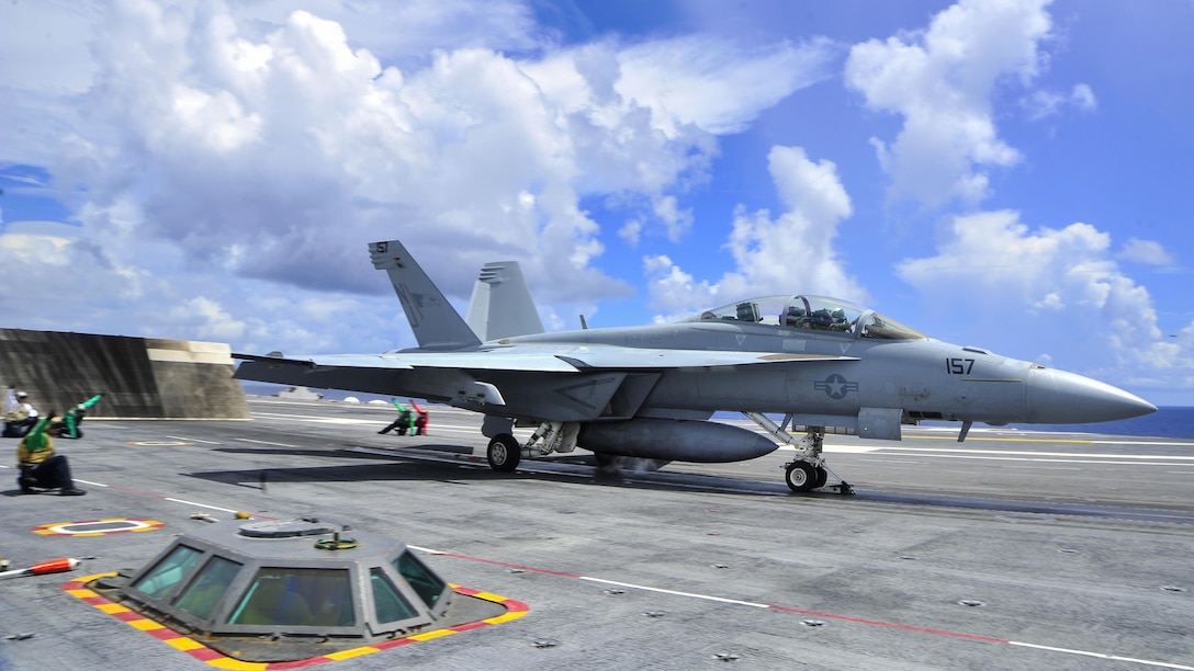 An F/A-18F Super Hornet prepares to launch from the flight deck of the aircraft carrier USS George Washington in the Atlantic Ocean, July 19, 2016. The aircraft is assigned to Strike Fighter Squadron 122. Navy photo by Seaman Apprentice Krystofer N. Belknap