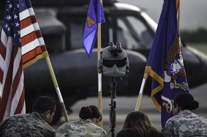 Members of Joint Task Force-Bravo and the Honduran air force pay their respects to U.S. Army Spc. Kyle Gantt during Gantt’s memorial service at Soto Cano Air Base, Honduras, July 24, 2016. Gantt is survived by his wife, two children, mother, and father. (U.S. Air Force photo by Staff Sgt. Siuta B. Ika)