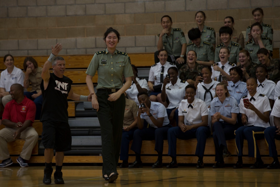 A member from the Chinese military women’s basketball team volunteers to participate in the opening ceremony for the 2016 Conseil International Du Sport Militaire (CISM) World Military Women’s Basketball Championship July 25 at Camp Pendleton, California. Camp Pendleton is hosting the 2016 CISM World Military Women’s Basketball Championship tournament July 25 through July 29 to promote peace activities and solidarity among athletes through sports. (U.S. Marine Corps photo by Sgt. Abbey Perria)
