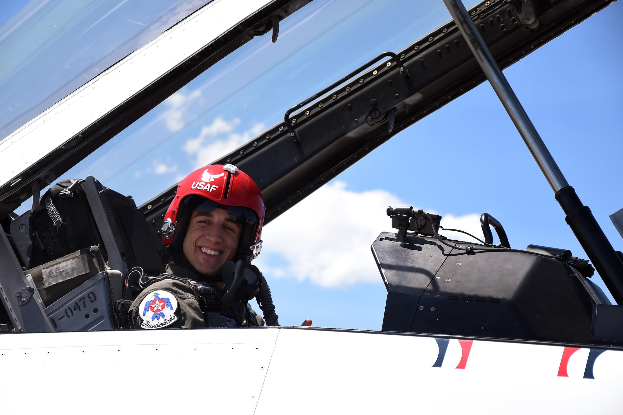Sage Kimzey, championship bull rider, smiles as he prepares to take off in an F-16 piloted by Maj. Kevin Walsh, U.S. Air Force Thunderbirds operations officer, July 25, 2016. Kimzey rode in the passenger seat as Walsh performed various maneuvers including barrel-rolls, loops and low-altitude maneuvers. (U.S. Air Force photo by Senior Airman Brandon Valle)