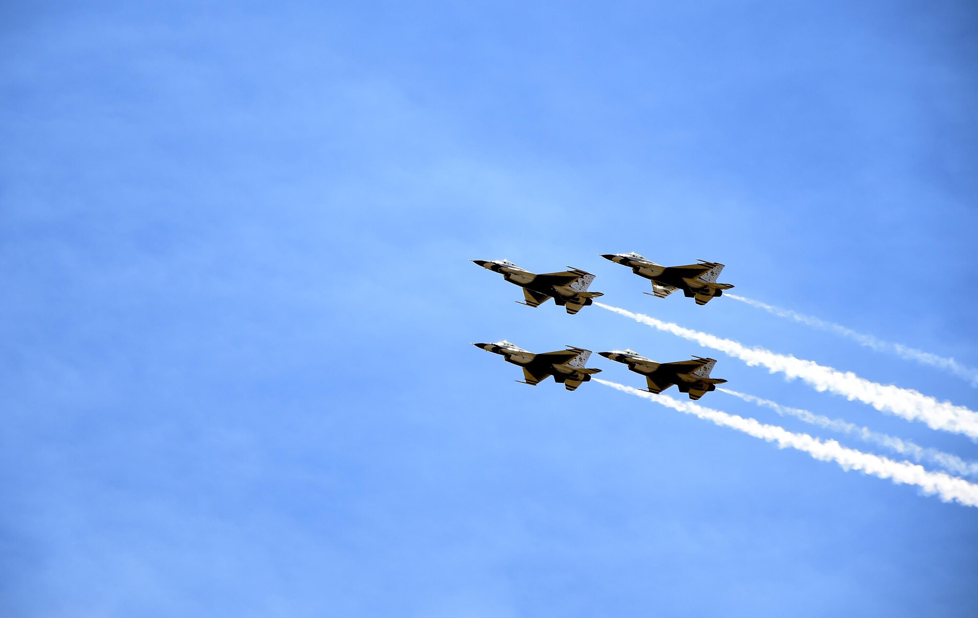 The U.S. Air Force Thunderbirds fly over the Wyoming Air National Guard Base, Cheyenne, Wyo., during a practice flight July 25, 2016. The Thunderbirds will perform a free aerial demonstration at Laramie County Community College at 9:30 a.m., July 27, 2016. (U.S. Air Force photo by Senior Airman Brandon Valle)