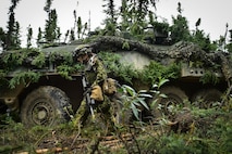 Canadian Army Maj. Chelsea Anne Braybrook, commander of Bravo Company, 1st Battalion, Princess Patricia’s Canadian Light Infantry, walks past her Coyote Armoured Vehicle in Donnelly Training Area near Ft. Greely, Alaska, during the Arctic Anvil exercise, Sunday, July 24, 2016.  Arctic Anvil is a joint, multinational exercise which includes forces from USARAK’s 1st Stryker Brigade Combat Team, 25th Infantry Division and UATF, along with forces from the 196th Infantry Brigade’s Joint Pacific Multinational Readiness Capability, the Iowa National Guard’s 133rd Infantry Regiment and the 1st Battalion, Princess Patricia’s Canadian Light Infantry. (U.S. Air Force photo/Justin Connaher)