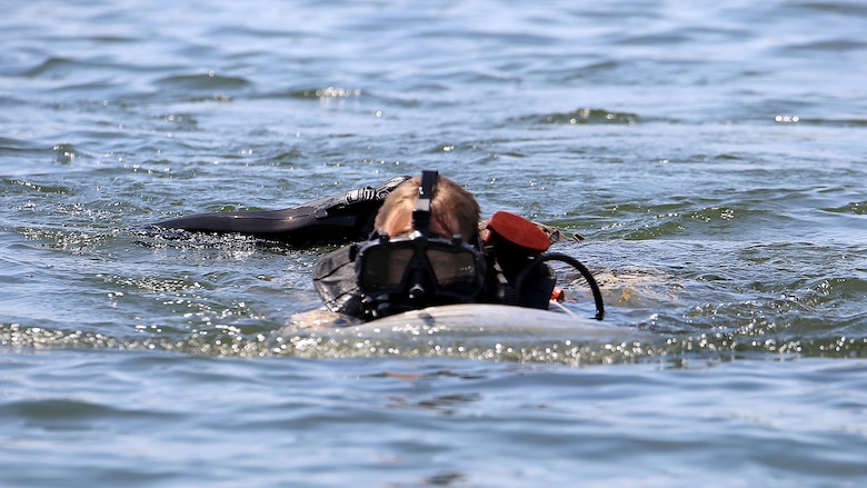 Master Sgt. Brad Colbert, project officer for small craft and special projects with Reconnaissance and Amphibious Raids at Marine Corps Systems Command, drives a diver propulsion device July 18 at Lake Anna in Spotsylvania, Virginia. Colbert and other members of the RAR team conducted tests of potential upgrades to the DPD to improve its speed and controllability for reconnaissance Marines.