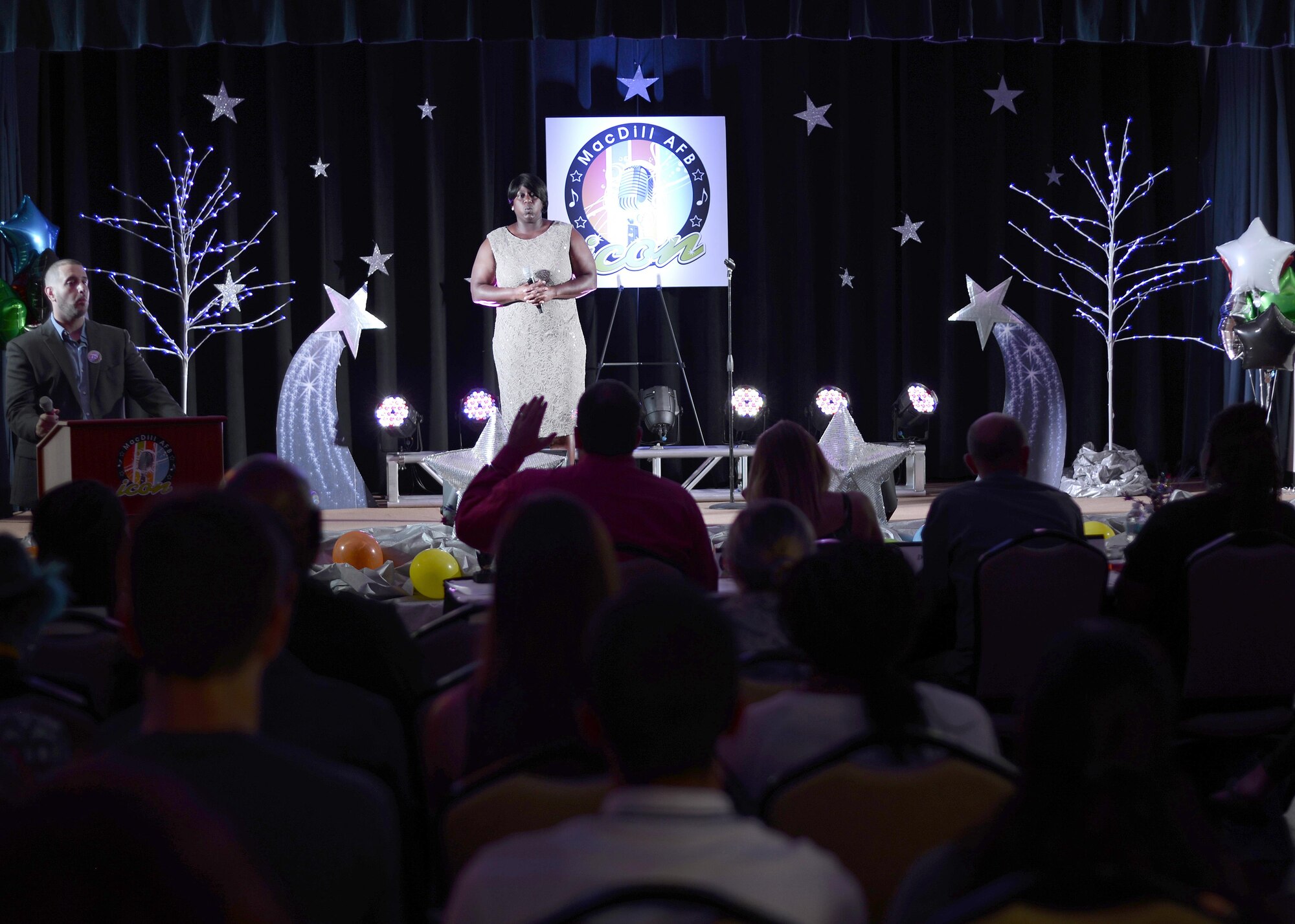 Tiffany Saminie, Army retired, receives feedback from the judges during the MacDill Icon singing competition at MacDill Air Force Base, Fla., July 20, 2016. Contestants were comprised of service members, veterans and family members throughout not only the 6th Air Mobility Wing, but also numerous tenant organizations. (U.S. Air Force photo by Tech. Sgt. Krystie Martinez)