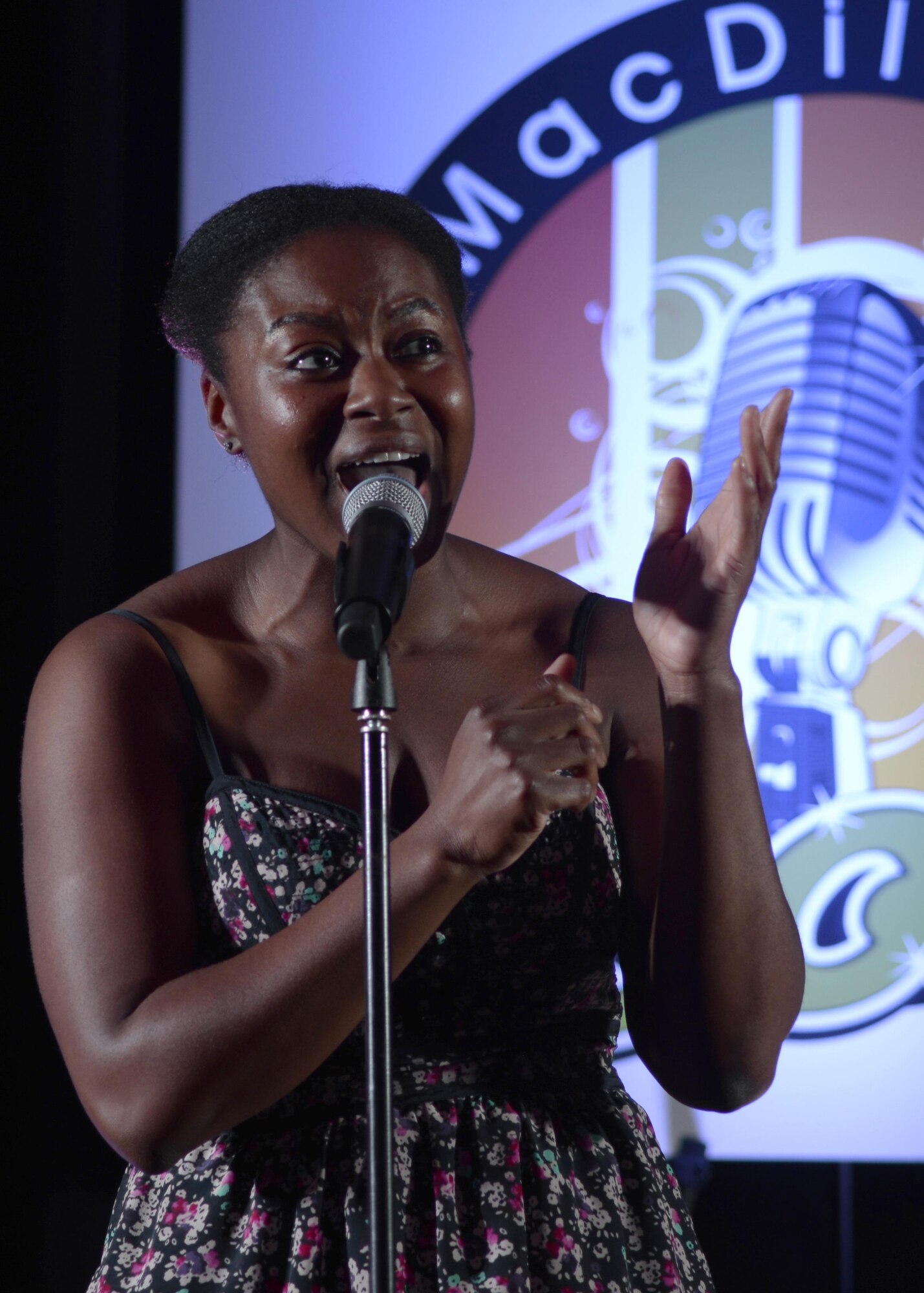 Airman 1st Class Anaya Wright, a medical administrator assigned to the 45th Aeromedical Evacuation Squadron, performs in the MacDill Icon singing competition at MacDill Air Force Base, Fla., July 20, 2016. Contestants were judged on overall singing ability and showmanship as they performed pre-selected songs in front of an audience of nearly 250 people. (U.S. Air Force photo by Tech. Sgt. Krystie Martinez)