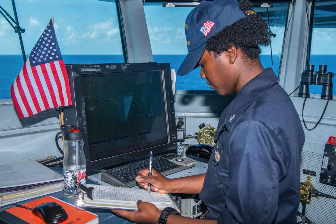 Navy Petty Officer 3rd Class Raven Kendall logs the position of USS John C. Stennis while standing quartermaster of the watch on the ship’s navigation bridge during Rim of the Pacific 2016 in the Pacific Ocean, July 20, 2016. Navy photo by Petty Officer 3rd Class Tomas Compian