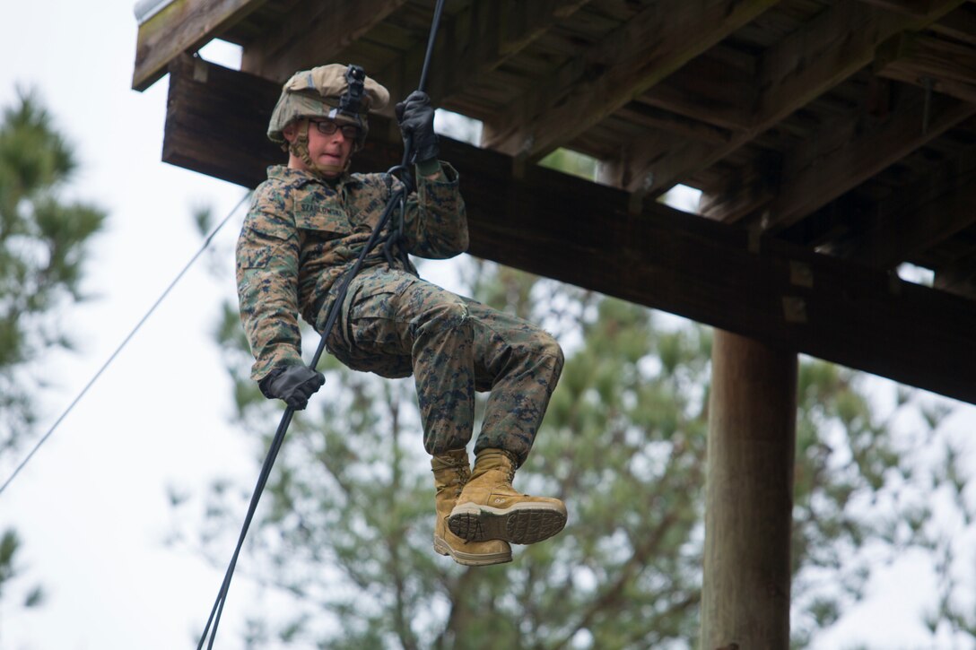 U.S. Marine Corps Lance Cpl. Kyle Szablowski, with Bravo Company, Battalion Landing Team, 1st Battalion, 6th Marine Regiment, 22nd Marine Expeditionary Unit, rappels off a tower at Fort Pickett, Va., Feb. 7, 2016. The Marines conducted the exercise in preparation for an upcoming deployment and to ensure mission readiness.