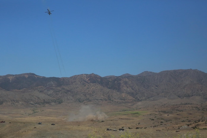 An AH-1Z Viper helicopter sends rockets down range at targets during the “helicopter gun run” during a Jane Wayne Day event on Camp Pendleton, Calif., July 16, 2016. Pilots with Marine Light Attack Helicopter Training Squadron 303 shot rockets and ammunition at various targets from one UH-1Y Huey helicopter, two AH-1W Cobra helicopters and one AH-1Z Cobra helicopter. (U.S. Marine Corps photo by Lance Cpl. Shellie Hall)