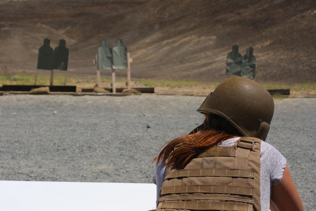 A woman fires the M4 carbine service rifle during a Jane Wayne Day event on Camp Pendleton, Calif., July 16, 2016. The event included the HIMARS live fire, a crew-served weapons demonstration, an M777A2 Howitzer shoot, a helicopter gun run with one UH-1Y Huey helicopter, two AH-1W Cobra helicopters and one AH-1Z Cobra helicopter, and an opportunity for family members to shoot the M4 carbine. (U.S. Marine Corps photo by Lance Cpl. Shellie Hall)