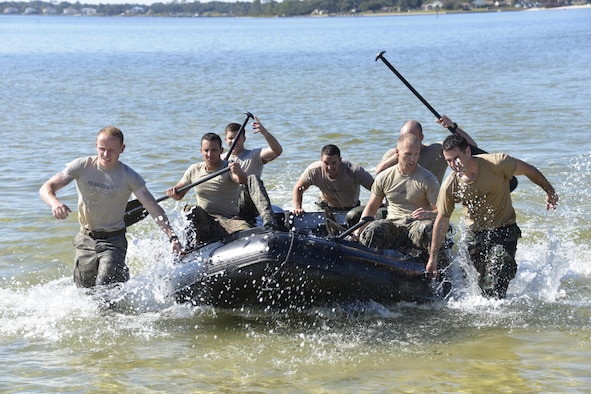 Special Tactics officer candidates pull a Zodiac boat to the shore during a selection at Hurlburt Field, Fla., Oct. 21, 2014. Special Tactics career field training pipelines are some of the most physically and psychologically challenging in the Air Force. To ensure the correct individuals are on the battlefield, a group of Special Tactics Airmen weed out the cross-training candidates who don’t meet the high standards, putting them through a week-long selection process to select only the best-qualified individuals. (U.S. Air Force photo by 1st Lt. Katrina Cheesman) 
