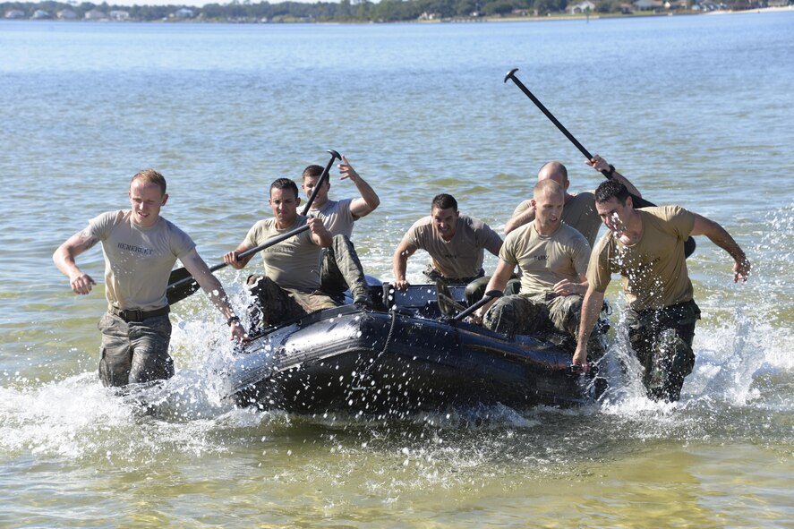 Special Tactics officer candidates pull a Zodiac boat to the shore during a selection at Hurlburt Field, Fla., Oct. 21, 2014. Special Tactics career field training pipelines are some of the most physically and psychologically challenging in the Air Force. To ensure the correct individuals are on the battlefield, a group of Special Tactics Airmen weed out the cross-training candidates who don’t meet the high standards, putting them through a week-long selection process to select only the best-qualified individuals. (U.S. Air Force photo by 1st Lt. Katrina Cheesman) 
