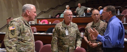 John Newman (far right), Army Reserve Ambassador for the state of Illinois, speaks with (left to right) Maj. Gen. Les Carroll, commanding general of the 377th Theater Sustainment Command, Maj. Gen. Michael R. Smith Deputy Chief of Army Reserve and Maj. Gen. Patrick Reinert, 88th RSC commanding general, during the 88th Regional Support Command’s Army Reserve Ambassador Workshop on Fort McCoy, July 15.