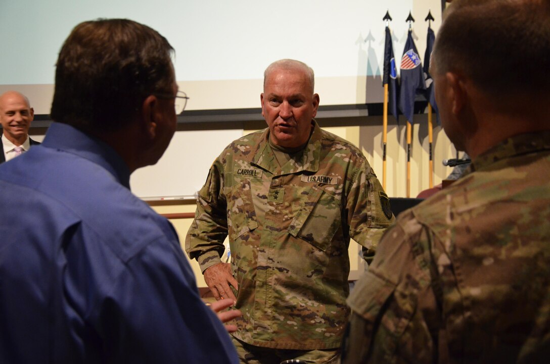 John Newman (left), Army Reserve Ambassador for the state of Illinois, speaks with Maj. Gen. Les Carroll (center), commanding general of the 377th Theater Sustainment Command, and Maj. Gen. Patrick Reinert (right), 88th RSC commanding general, during the 88th Regional Support Command’s Army Reserve Ambassador Workshop on Fort McCoy, July 15.