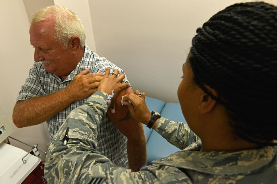 U.S. Air Force Senior Airman Tamika Bradley, 20th Medical Operations Squadron allergy and immunizations technician, cleans a patient’s skin before administering a vaccine at Shaw Air Force Base, S.C., July 20, 2016. Although Defense Department employees require regular vaccinations, some individuals cannot receive vaccines due to a weakened immune system. (U.S. Air Force photo by Airman 1st Class Destinee Dougherty)