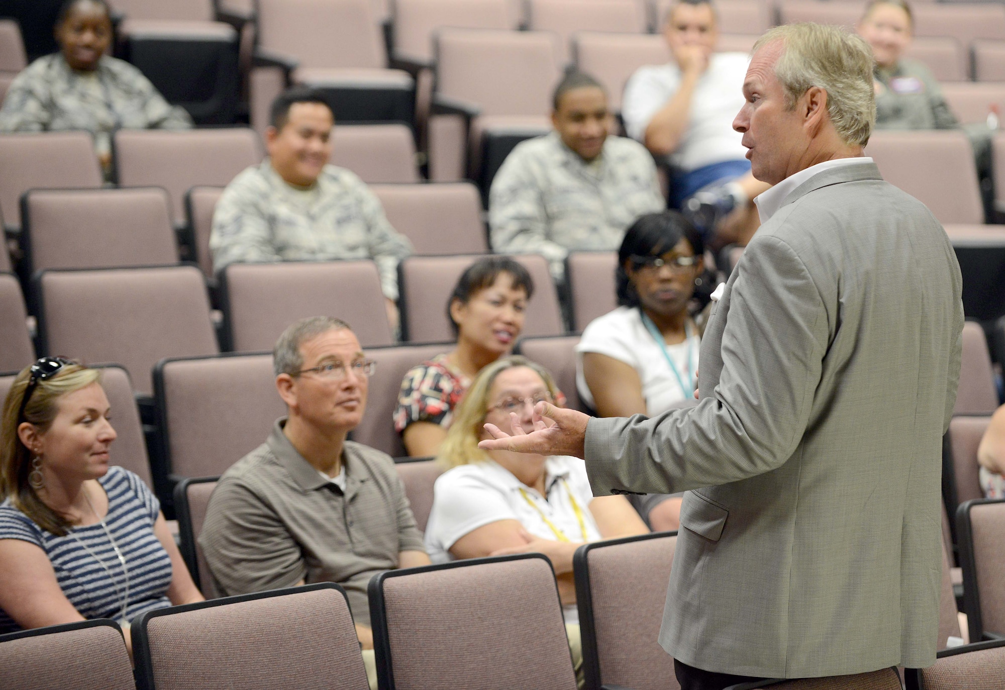 Dan Clark, world-renowned motivational speaker and New York Times best-selling author of “Chicken Soup for the Soul” and “The Art of Signifi-cance,” speaks at one of three sessions in the Base Theater July 14. (U.S. Air Force photo by Tommie Horton)