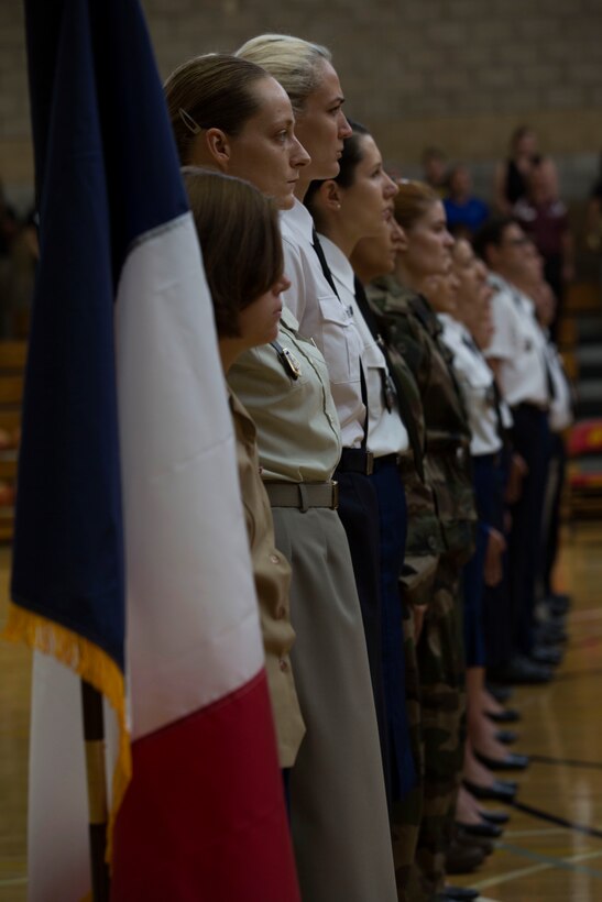 Members of the French military women’s basketball team stand at attention during the playing of the 2016 Conseil International Du Sport Militaire (CISM) anthem July 25 at Camp Pendleton, California. The base is hosting the CISM World Military Women’s Basketball Championship July 25 to July 29 to promote peace activities and solidarity among military athletes through sports. (U.S. Marine Corps photo by Sgt. Abbey Perria)