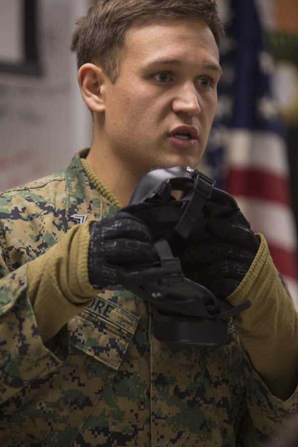 U.S. Marine Corps Cpl. Nicholas Moore, a Chemical, Biological, Radiological, and Nuclear defense specialist assigned to the 22nd Marine Expeditionary Unit, briefs Marines before participating in a gas chamber training exercise at Fort Pickett, Va., Feb. 15, 2016. The training was conducted as part of annual training required for the Marines preparing for an upcoming deployment.
