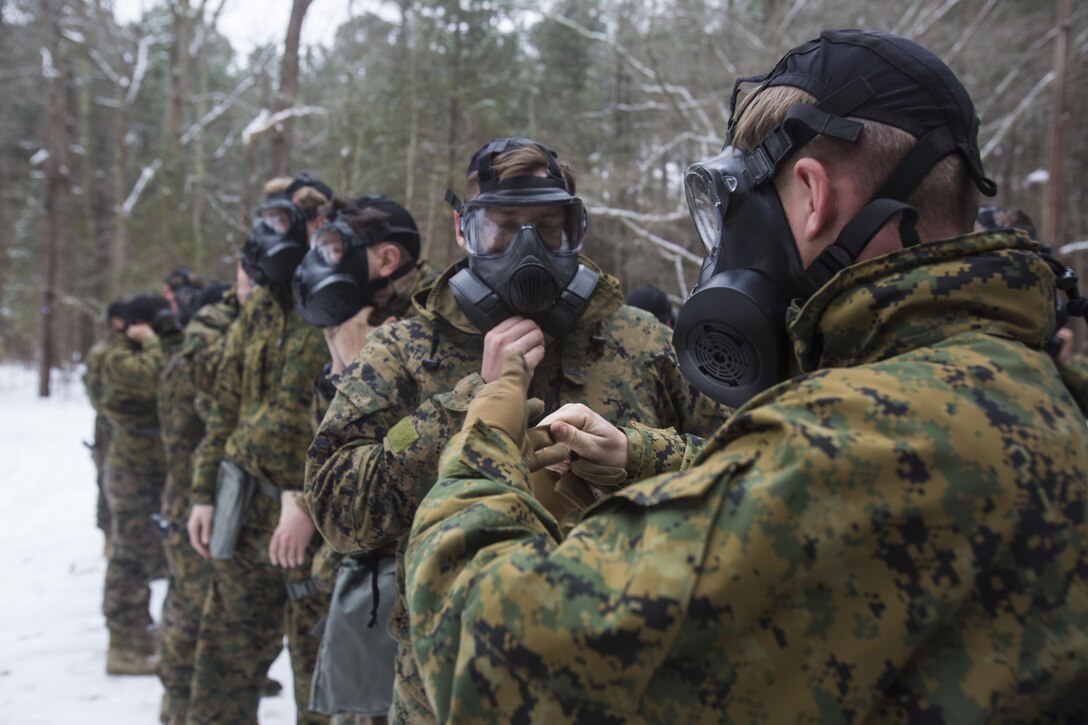 U.S. Marines assigned to the 22nd Marine Expeditionary Unit practice clearing their M50 Joint Service General Purpose Mask before entering the gas chamber during a training exercise at Fort Pickett, Va., Feb. 15, 2016. The training was conducted as part of annual training required for the Marines preparing for an upcoming deployment.
