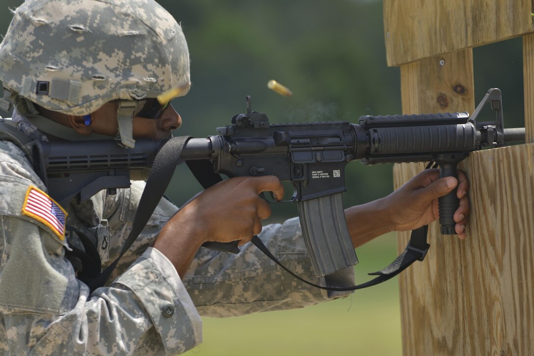 U.S. Army Pvt. Cornelius Cooley, 690th Rapid Port Opening Element cargo handler, fires an M4 rifle during a range training exercise at Fort Eustis, Va., July 20, 2016. While this training is not a requirement, it is conducted to enhance the units’ combat readiness. (U.S. Air Force photo by Staff Sgt. Natasha Stannard)